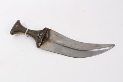 Lot 138 - Mid-20th century Arab Jambia dagger with horn hilt and white metal and brown mounts, with sheath and original woven belt