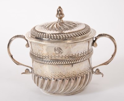 Lot 334 - A William and Mary silver porringer and associated cover