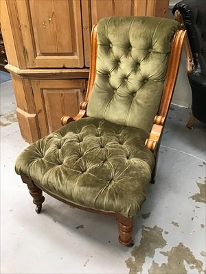 Lot 96 - A late Victorian oak framed nursing chair with buttoned velvet upholstery on turned legs