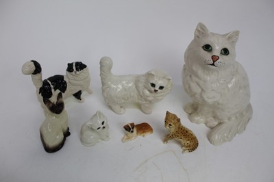 Lot 905 - Group five Beswick cat ornaments, together with a Royal Doulton cat and dog ornament (7)