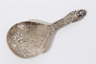 Lot 291 - William Comyns silver sifter spoon in Gothic style