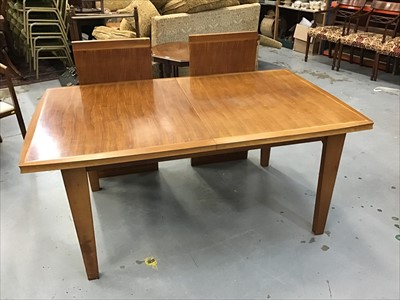 Lot 912 - Walnut extending dining table with two extra leaves on taper legs, purchased from Heals circa 1960's