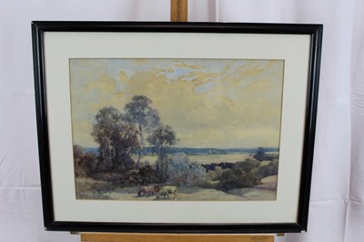 Lot 944 - George Robert Rushton (1869-1947) three watercolours - cattle grazing in extensive landscape, 35cm x 50cm, hilly landscape, 27cm x 38cm and low tide on the estuary, 27cm x 37cm, each in glazed fram...