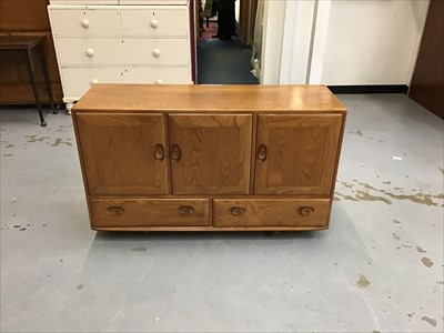 Lot 921 - Ercol sideboard with three cupboards and two drawers below