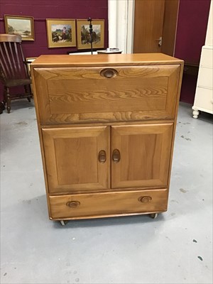 Lot 922 - Ercol unit with fall front, two doors and single drawer below