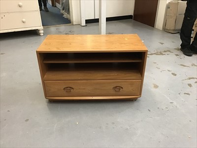 Lot 924 - Ercol television unit with open shelf and single drawer below