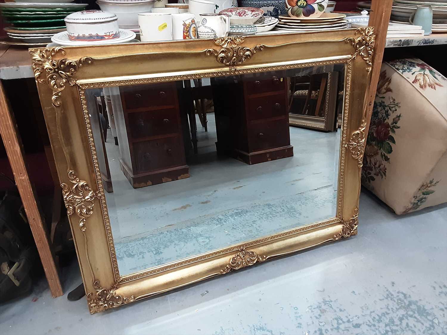 Lot 935 Bevelled wall mirror in ornate gilt frame