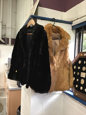 Lot 40 - Ladies caramel coloured short fur coat, and a similar black fur coat (2)