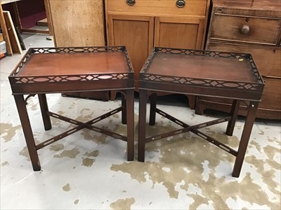 Lot 949 - Pair of mahogany occasional tables with pierced gallery tops on chamfered legs joined