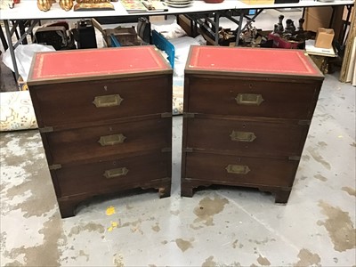 Lot 956 - Pair of military style mahogany three drawer chests with leather lined tops