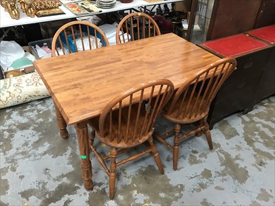 Lot 957 - Dining table and four matching stick back chairs