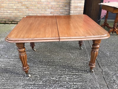 Lot 99 - Victorian mahogany extending dining table with one additional leaf.