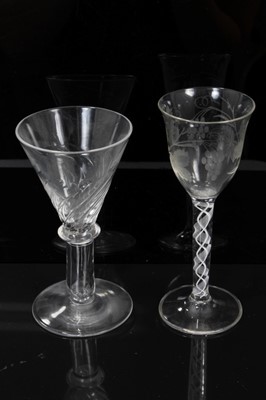 Lot 232 - Georgian-style opaque twist stem wine glass with etched foliate decoration to the bowl, and a further Georgian-style moulded wine glass (2)