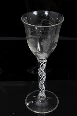 Lot 122 - Georgian-style opaque twist stem wine glass with etched foliate decoration to the bowl, and a further Georgian-style moulded wine glass (2)