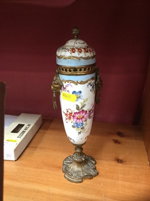 Lot 136 - 19th century Continental painted porcelain urn and cover with metal mounts