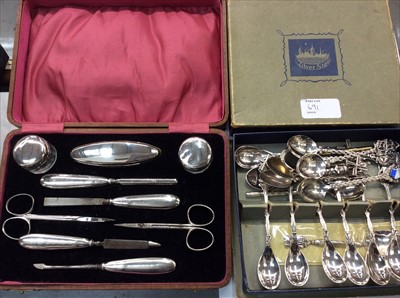 Lot 691 - Dutch white metal teaspoons, other plated souvenir spoons and silver manicure set in fitted case