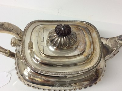 Lot 216 - Edwardian silver teapot of half fluted form with engraved heraldic crests