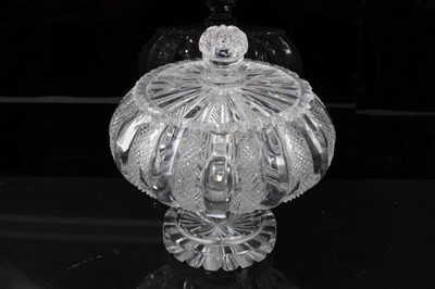 Lot 147 - Victorian diamond cut glass urn and cover, the fluted bowl on a stepped and faceted stem, above a star-cut circular foot, 17.5cm height