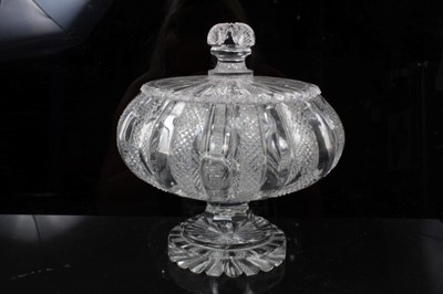 Lot 147 - Victorian diamond cut glass urn and cover, the fluted bowl on a stepped and faceted stem, above a star-cut circular foot, 17.5cm height