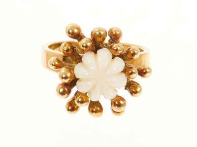 Lot 522 - 1970s 18ct gold cocktail ring by John Donald, the modernist design with central carved stone bud within beaded gold organic setting on plain polished gold shank, maker's mark JAD for John Donald, L...