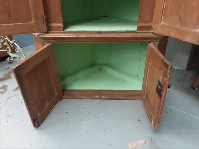 Lot 988 - Antique pine corner cupboard with shaped shelves and painted interior enclosed by panelled doors