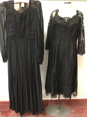 Lot 1798 - 1940s black silk crepe evening gown, shaped and pleated bodice, similar age  black lace gown and a later faux fur lined coat.