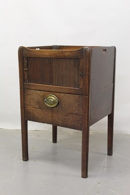 Lot 1255 - George III mahogany pot cupboard with tambour slide front