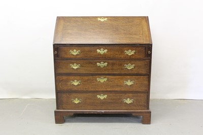 Lot 1224 - George III oak bureau.