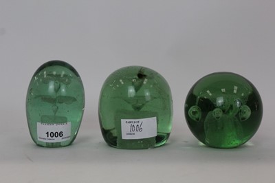 Lot 1006 - Three Victorian Green glass dump weights, circa. 1850