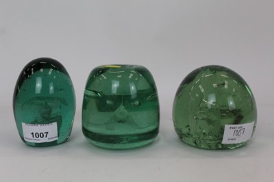 Lot 1007 - Three Victorian green glass dump weights to include one with a Sulphide figure