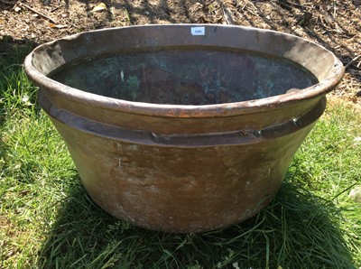 Lot 1280 - Copper vessel, with rounded base and stepped rim, 61cm diameter, together with a straight sided copper vessel