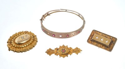 Lot 549 - Late Victorian diamond and ruby hinged bangle and three Victorian brooches