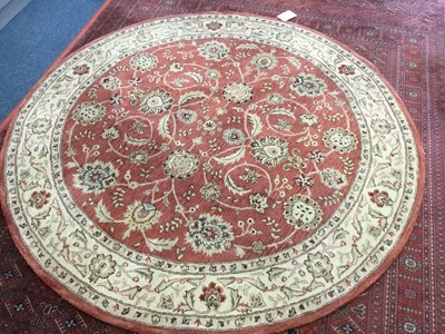 Lot 1052 - Circular floral rug on pink ground