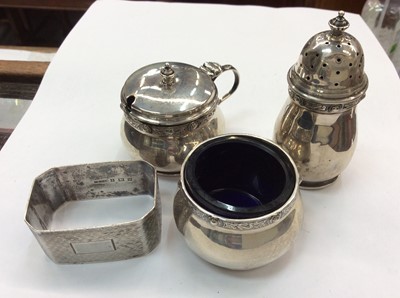 Lot 701 - Silver three piece cruet set and silver napkin ring