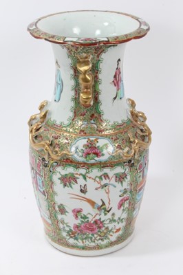Lot 184 - Late 19th century Chinese famille rose baluster vase, painted in the Canton style with figural scenes, flowers and birds, with moulded foo dog handles and dragons, 33.5cm height