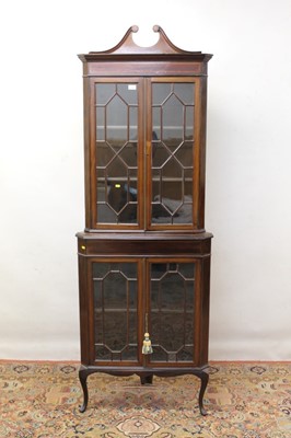 Lot 860 - Edwardian two height glazed standing corner cupboard