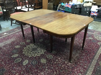 Lot 1063 - Georgian mahogany D end dining table with extra leaf on taper legs and brass castors