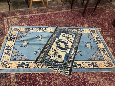 Lot 1066 - Two 1930s Chinese rugs on blue and cream ground (2)