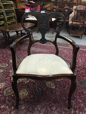 Lot 1068 - Edwardian mahogany elbow chair with carved floral decoration on cabriole legs