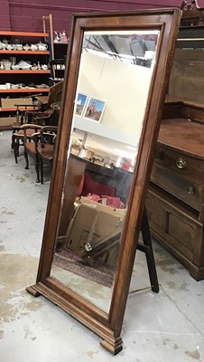 Lot 866 - Large bevelled mirror in walnut frame with easel back