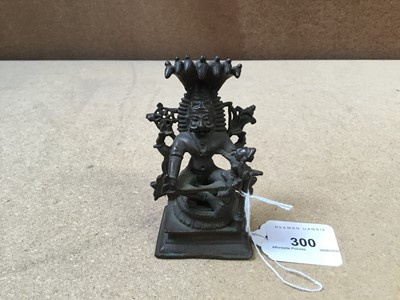 Lot 300 - 19th century Indian bronze figure of a seated deity with snakes on retangular stepped base 10cm high