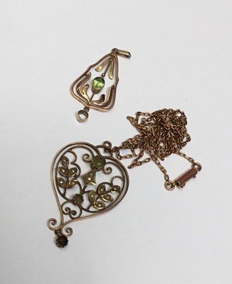 Lot 152 - Edwardian gold peridot and seed pearl pendant on a chain and a similar pendant