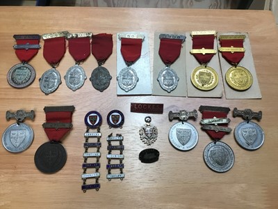 Lot 306 - Colchester Borough Education medals including 1909 silver ( consecutive year clasp medal , various other punctuality and attendance medals by Spinks, Colchester United enamel supporters club badges...