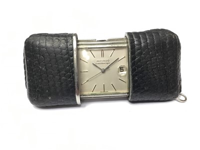 Lot 192 - 1950s-1960s Movado Ermetoscope stainless steel and black leather purse watch with silvered dial with date , Serial no. 1264731M .