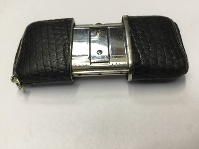 Lot 192 - 1950s-1960s Movado Ermetoscope stainless steel and black leather purse watch with silvered dial with date , Serial no. 1264731M .