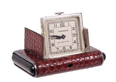 Lot 175 - 1930s Art Deco Tavannes travelling watch in snakeskin covered silver cased this end pushers to open the trap door revealing folding silvered dial signed 'Tavannes La Captive' Swiss silver marks