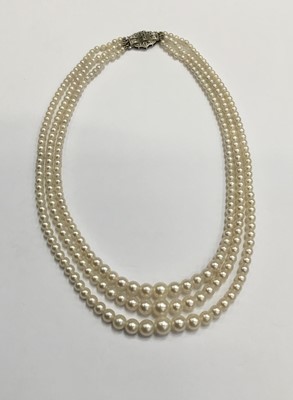 Lot 200 - Cultured pearl three strand choker necklace with three strings of graduated cultured pearls measuring approximately 2.3mm- 7.4mm, on an Art Deco style 9ct white gold and diamond set clasp. Length a...