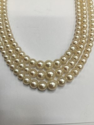 Lot 200 - Cultured pearl three strand choker necklace with three strings of graduated cultured pearls measuring approximately 2.3mm- 7.4mm, on an Art Deco style 9ct white gold and diamond set clasp. Length a...