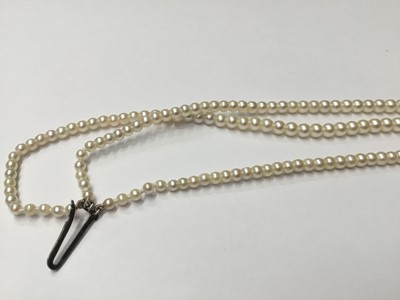 Lot 200 - Cultured pearl three strand choker necklace with three strings of graduated cultured pearls measuring approximately 2.3mm- 7.4mm, on an Art Deco style 9ct white gold and diamond set clasp. Length a...