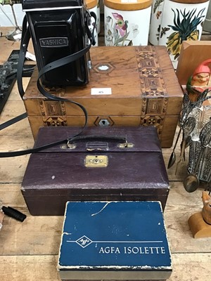 Lot 45 - Black Forest carvings, two cameras, walnut writing slope, jewellery box with costume jewellery, other items